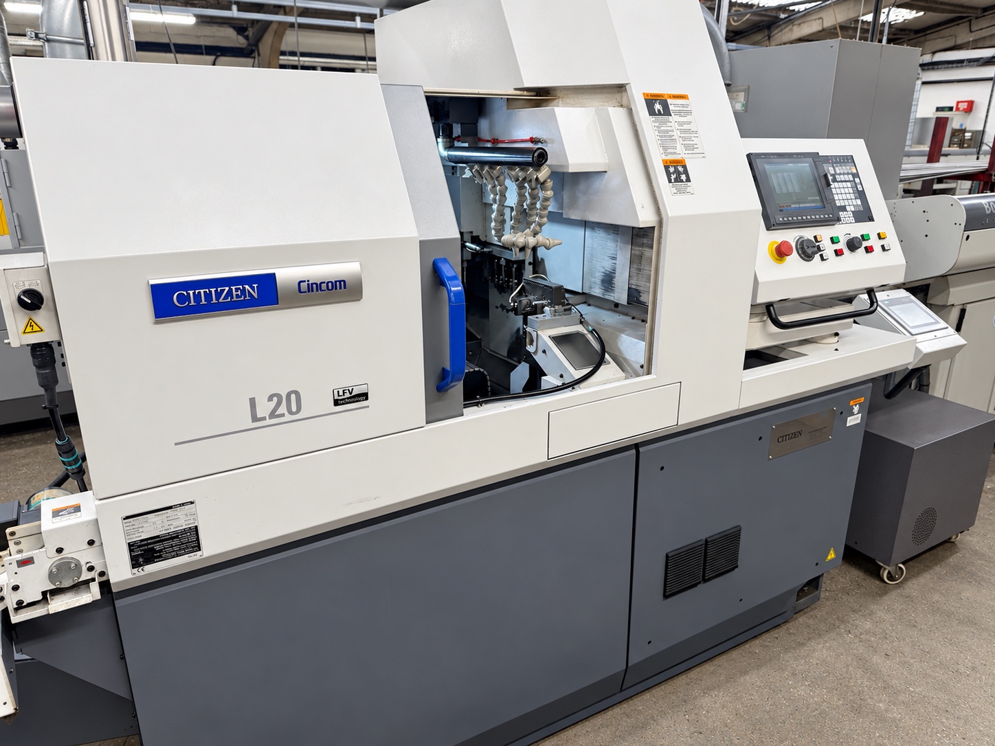 Citizen L20-X LFV with machining enclosure open and CNC control visible